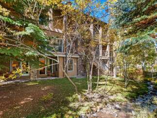 Experience the charm of autumn with this stunning property nestled amidst vibrant fall foliage.