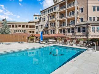 Enjoy a luxurious resort-style living experience with this stunning outdoor pool and spa area.