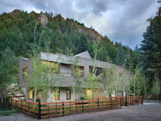 Nestled against a majestic mountain backdrop, this contemporary home offers a unique blend of modern architecture and natural beauty.