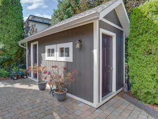 Enhance your outdoor living space with this charming garden shed, perfect for storage or as a creative studio.