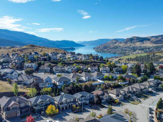 Discover this stunning hillside community offering breathtaking panoramic views of the serene lake and majestic mountains.