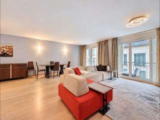 Experience modern living in this spacious open-concept living and dining area, perfect for entertaining.