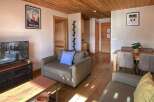 Experience the charm of this cozy living space, perfect for your next mountain getaway.