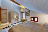 Discover this charming attic bedroom, perfect for a cozy retreat.