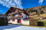 Experience the charm of this traditional chalet nestled in a picturesque mountain landscape.
