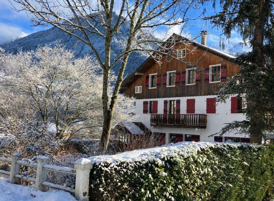 Experience the charm of this winter wonderland property, nestled against a backdrop of snow-capped mountains.