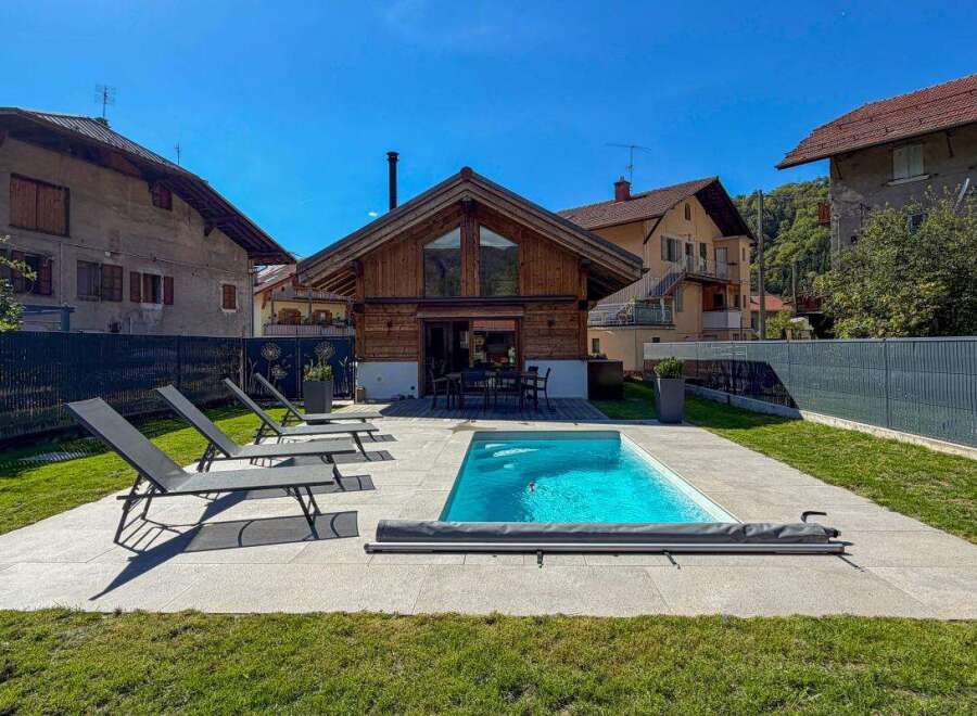 Enjoy a relaxing getaway in this charming property featuring a private swimming pool and ample lounge chairs for sunbathing.
