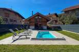 Enjoy a relaxing getaway in this charming property featuring a private swimming pool and ample lounge chairs for sunbathing.