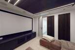 Experience cinematic bliss in this modern home theater, featuring a massive projection screen and plush seating for ultimate comfort.