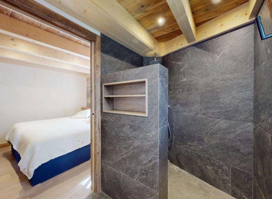 Experience the perfect blend of rustic charm and modern luxury in this stunning bedroom and ensuite.
