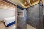Experience the perfect blend of rustic charm and modern luxury in this stunning bedroom and ensuite.