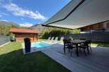 Enjoy the ultimate outdoor living experience with this stunning property featuring a sparkling swimming pool and a spacious wooden deck perfect for entertaining.