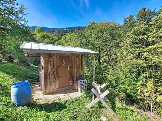 Discover this charming rustic outbuilding, perfect for storage or as a unique workshop space.