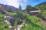 Discover this charming property nestled in a serene, mountainous landscape.