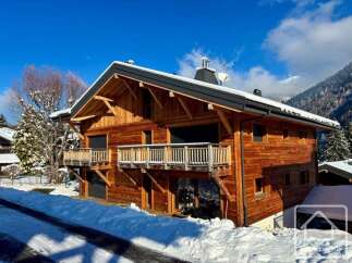 Experience luxury mountain living in this stunning wooden chalet, nestled amidst snow-covered landscapes and majestic peaks.