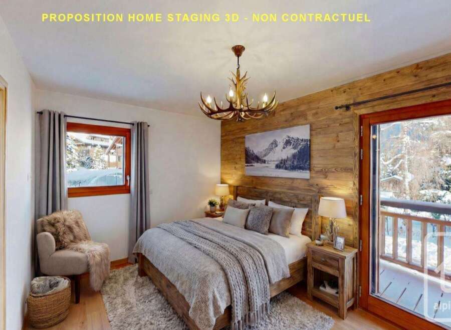 Experience cozy mountain living in this charming bedroom, featuring a rustic wooden accent wall and a plush, inviting bed.