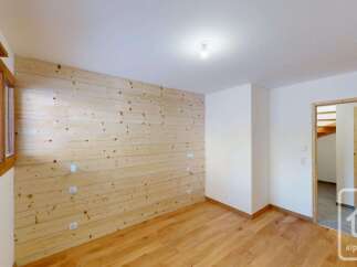 Experience the charm of this alpine property featuring beautifully paneled wood walls and a warm, inviting atmosphere.