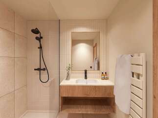 Experience modern luxury in this beautifully designed bathroom, featuring a sleek black showerhead and a spacious walk-in shower with elegant tilework.