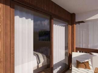 Experience modern mountain living with this stunning balcony, featuring rich wooden paneling and large sliding glass doors that offer breathtaking views.