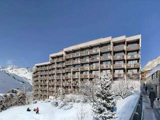 Experience luxury mountain living in this stunning ski resort property, boasting panoramic views of snow-capped peaks and a modern architectural design.
