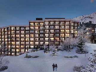 Experience luxury mountain living in this stunning ski resort property, featuring a modern architectural design with expansive balconies offering breathtaking views.