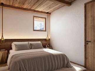 Experience rustic charm in this cozy bedroom, featuring exposed wooden beams and a textured white wall.