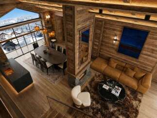 Experience luxury mountain living in this stunning chalet, featuring a spacious open-plan living area with a modern fireplace and a large dining space perfect for entertaining.
