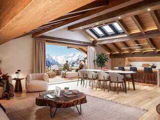 Experience luxury mountain living in this stunning open-concept chalet, featuring a spacious living area with a cozy fireplace and breathtaking panoramic views of snow-capped peaks.