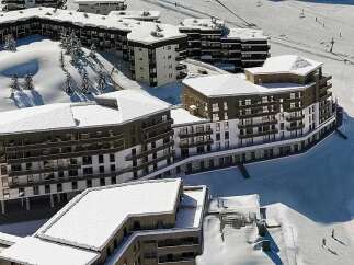 Experience luxury mountain living in this stunning ski resort development, featuring modern architecture and prime slopeside access.