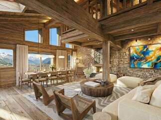 Experience luxury mountain living in this stunning chalet, featuring a grand open-plan living area with exposed wooden beams and a cozy stone fireplace.