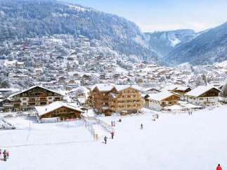Experience the ultimate alpine lifestyle in this stunning ski resort village, nestled amidst snow-capped mountains and charming chalets.