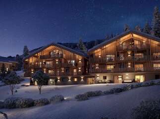 Experience luxury mountain living in these stunning wooden chalets, nestled amidst a serene winter landscape under a starry night sky.