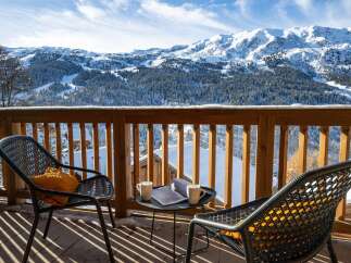 Experience breathtaking mountain views from this stunning balcony, perfect for enjoying your morning coffee or evening relaxation.