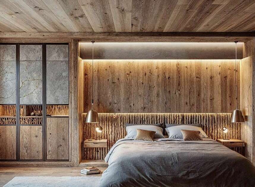 Experience rustic luxury in this master bedroom, featuring a stunning wooden accent wall behind the bed, complemented by warm ambient lighting.