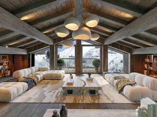 Experience luxury mountain living in this stunning chalet-style living room.