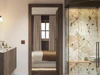 Experience luxury living with this stunning master suite, featuring a spa-like bathroom with a marble-accented shower and a sleek vanity.
