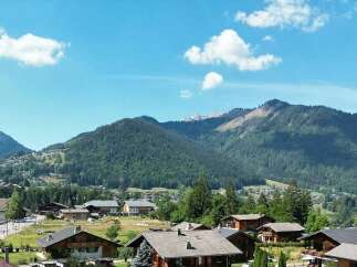 Nestled in a picturesque mountain village, this charming property offers breathtaking views of lush green slopes and snow-capped peaks.