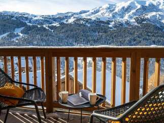 Experience breathtaking mountain views from this stunning balcony, perfect for enjoying your morning coffee or evening relaxation.