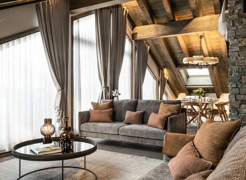 Experience luxurious mountain living in this stunning chalet-style living room.