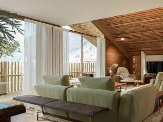 Experience luxurious mountain living in this stunning chalet-style living room.