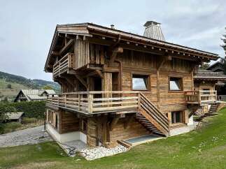 Experience rustic charm and modern luxury in this stunning wooden chalet, nestled amidst breathtaking mountain scenery.