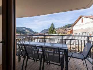 Enjoy breathtaking mountain views from this charming balcony, perfect for al fresco dining or morning coffee.