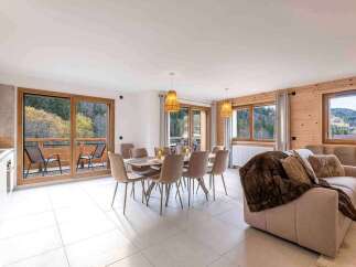 Experience luxurious mountain living in this spacious open-plan dining and living area.
