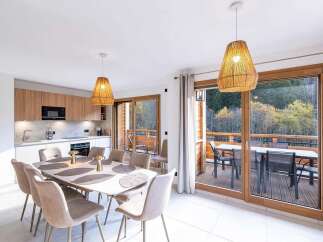 Experience modern living in this spacious dining and kitchen area, perfect for entertaining.