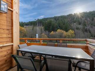 Enjoy breathtaking mountain views from this spacious outdoor dining area, perfect for al fresco meals.