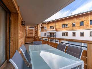 Enjoy your morning coffee or evening drinks on this spacious balcony, perfect for outdoor dining and relaxation.