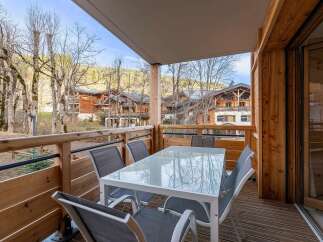 Enjoy breathtaking mountain views from this charming balcony, perfect for al fresco dining or morning coffee.