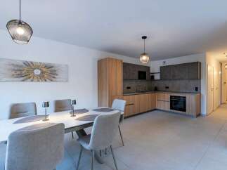 Experience modern living in this beautifully appointed dining and kitchen area.