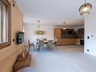 This modern apartment boasts a spacious open-plan living area, perfect for entertaining.