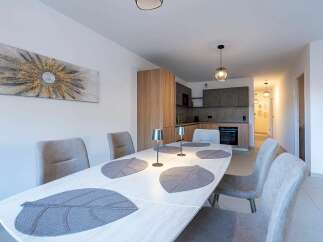 Experience modern living in this beautifully appointed dining area and kitchen.
